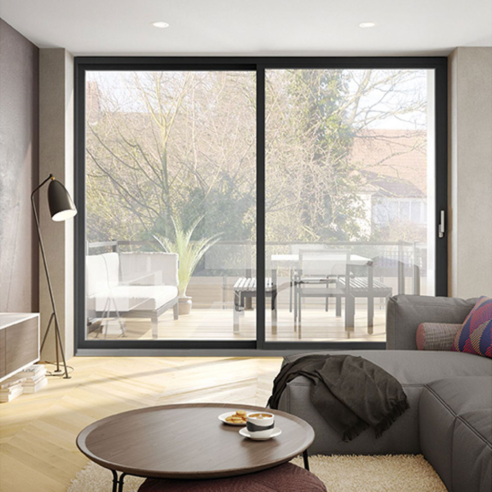 Man Using Measuring Tape in Factory Setting Man Using Measuring Tape in Factory Setting